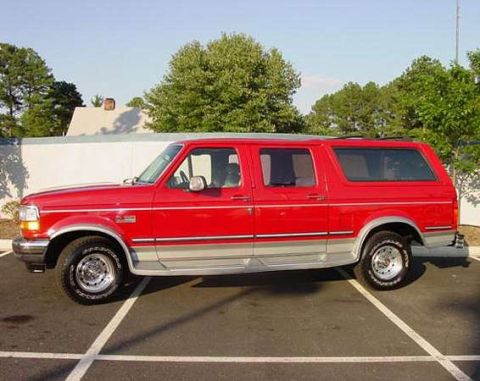 1994 Ford C-150 (Centurion Conversions) - This red extended cab pickup truck features a camper shell, giving it a wagon-like appearance.