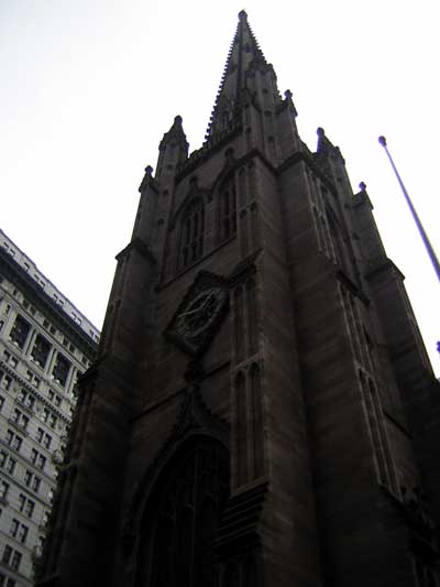 1995 Ford Bronco - A view looking up at the spire of a historic church, with a modern office building visible to the side.