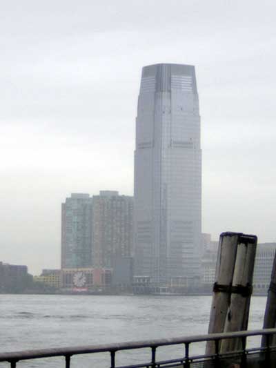 1995 Ford Bronco - Cityscape skyscrapers and a prominent clock tower, viewed from across the water.