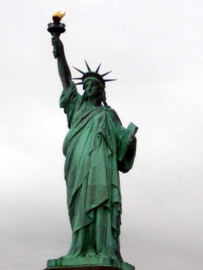 1995 Ford Bronco - The Statue of Liberty stands tall, a symbol of freedom against a muted sky.