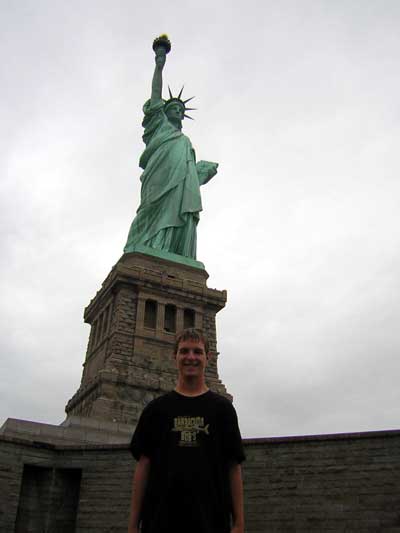 1995 Ford Bronco - Tourist poses for a photo with the Statue of Liberty in New York City.
