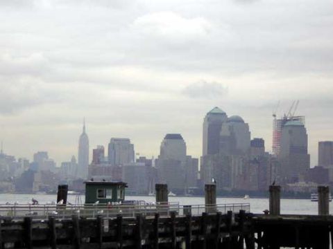 1995 Ford Bronco - View of the New York City skyline from a pier, with various skyscrapers and a cloudy sky.