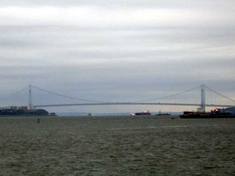 1995 Ford Bronco - Ships navigate the waters under the Verrazzano-Narrows Bridge on a cloudy day.