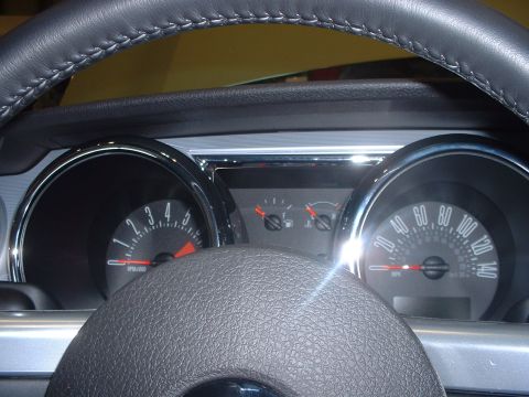 1999 Ford Crown Victoria - Close-up of a car's interior dashboard, showing the speedometer and tachometer gauges.