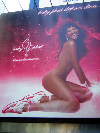 1995 Ford Bronco - A woman is captured in a dynamic pose against a vibrant pink and white backdrop.