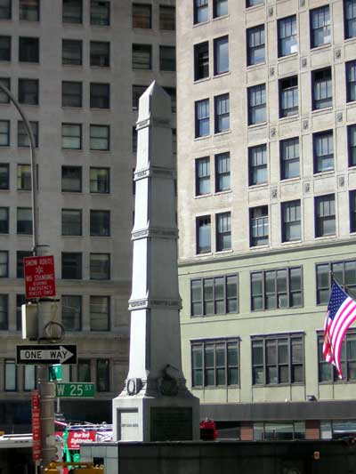 1995 Ford Bronco - A monument stands in front of buildings in New York City, with an American flag visible.