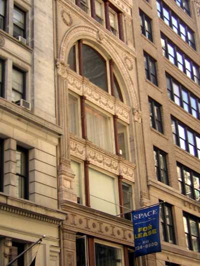1995 Ford Bronco - Building facade with ornate architectural details and a blue