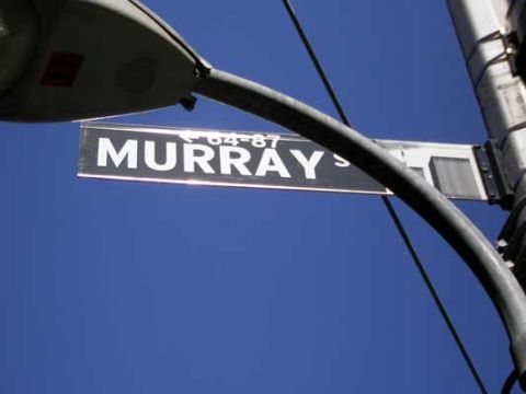1995 Ford Bronco - A street sign for Murray's is visible against a clear blue sky, mounted on a lamppost.