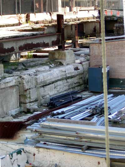 1995 Ford Bronco - A construction site is depicted with various building materials including steel beams and concrete.