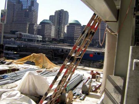 1995 Ford Bronco - A construction site is shown with various materials and buildings in the distance.