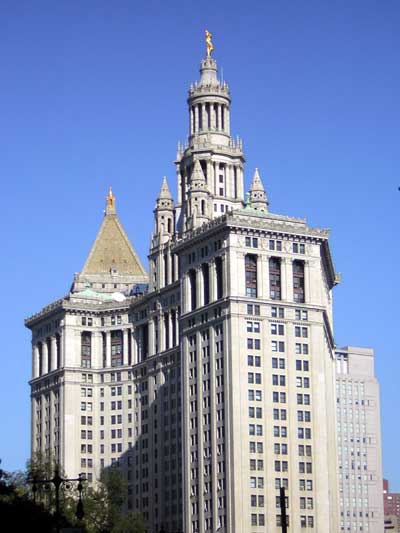 1995 Ford Bronco - New York City Hall, a prominent landmark, stands tall under a bright blue sky.