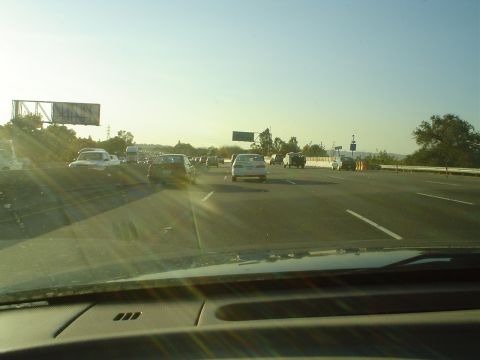 1993 Ford Taurus - Driving in traffic on a sunny day on the highway.