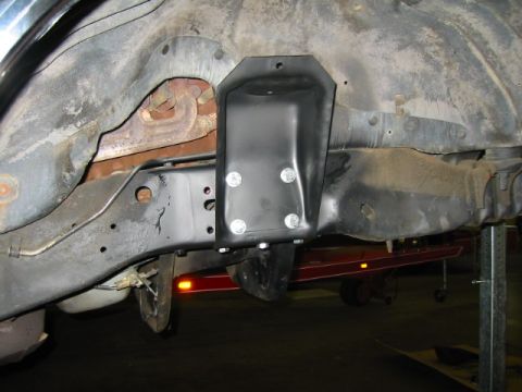1992 Ford Bronco - Close-up side view of the frame and suspension of a 1992 Ford Bronco, showing a newly installed component.