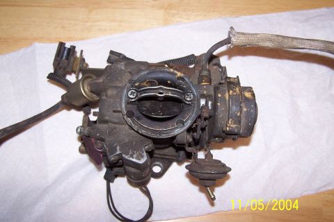 1979 Ford Bronco - This is a carburetor, a part of a vehicle's fuel system, shown here removed from its original location.