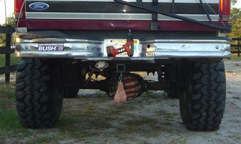 1993 Ford Bronco - This truck features oversized tires, a novelty drill on the license plate, and a patriotic-themed differential cover.