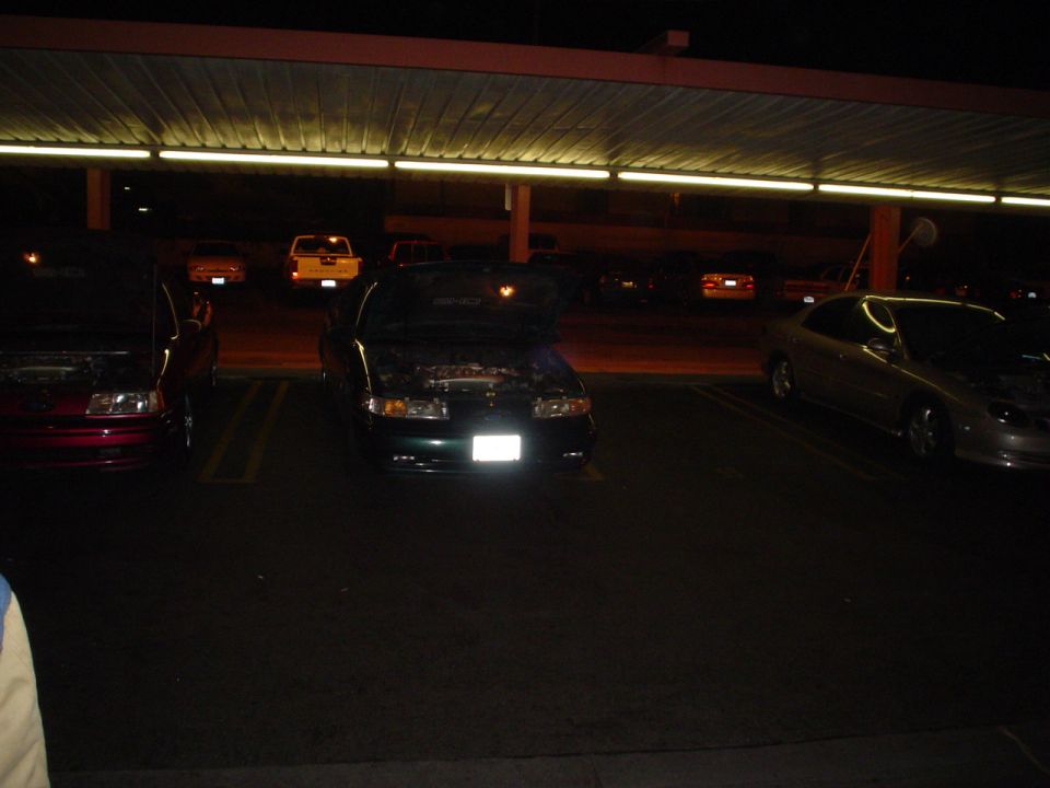1998 Mercury Sable with hood open, parked at night under a covered lot