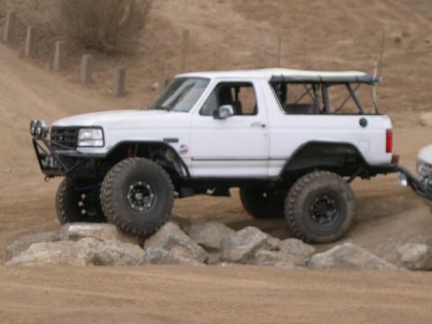1990 Ford Bronco - Modified 1990 Ford Bronco navigating rocky terrain.