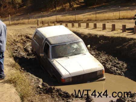 1990 Ford Bronco - This 1990 Ford Bronco is stuck deep in a muddy trench during an off-road excursion.