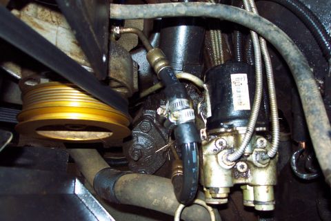 1996 Ford Bronco - Power Steering Pressure Hose Trail Repair. Soft tire patch, covered with split piece of heater hose and clamps directly over damaged area.…