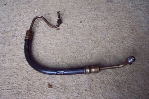 1996 Ford Bronco - Power Steering Pressure Hose Damage. The zip tie holding it away from contact with York OBA belt broke.