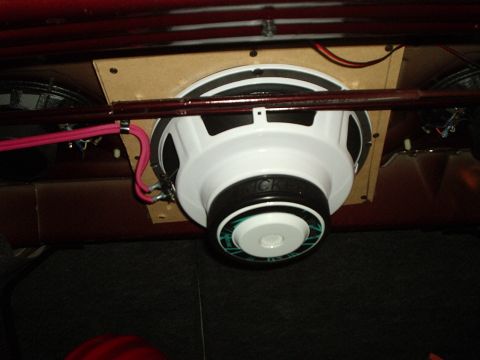 2000 Ford Taurus - Custom subwoofer installation with Kicker speaker and wiring in a vehicle.
