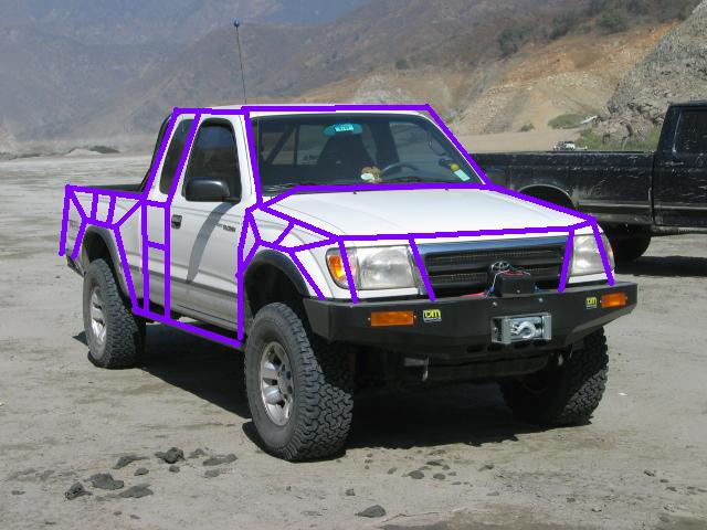 White 1999 Toyota Tacoma with purple roll cage and winch