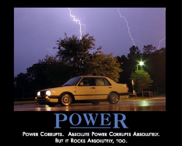Yellow Volkswagen Jetta sedan parked at night under lightning with POWER motivational caption text