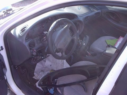 2000 Ford Taurus - Interior view of a 2000 Ford Taurus with the dashboard removed for repairs or modifications.
