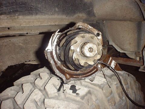 1988 Ford Bronco - A close-up view of a damaged water pump impeller, likely removed from a vehicle for repair or replacement.