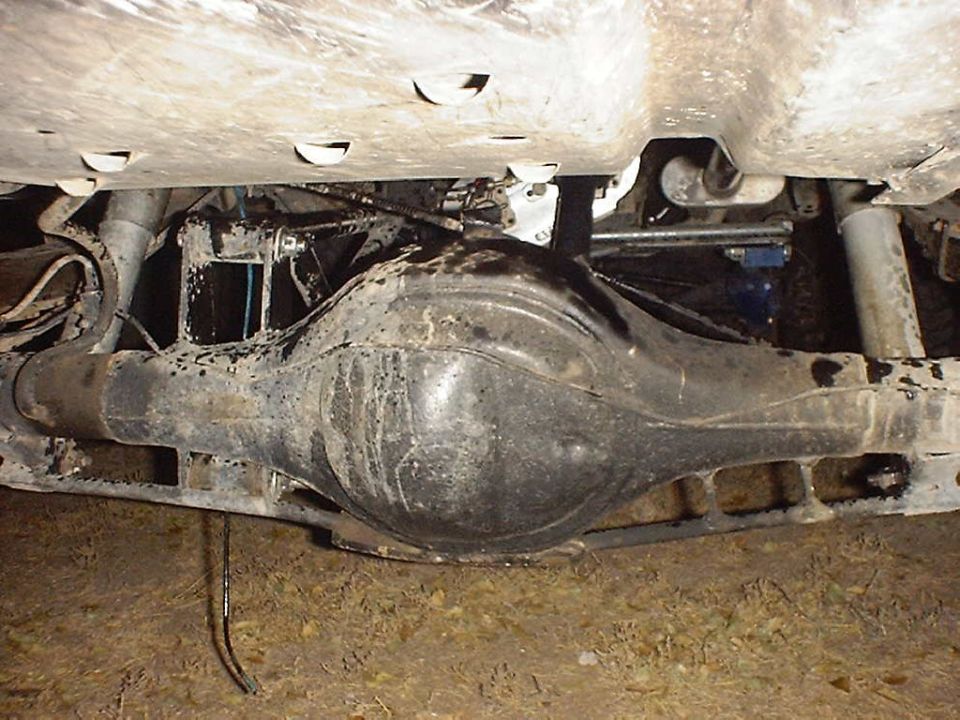 Underside view of a vehicle's rear differential and suspension components