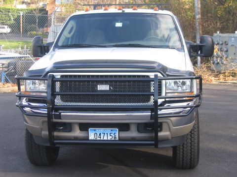 2003 Ford Excursion - This 2003 Ford Excursion is shown from the front, equipped with a heavy-duty black grille guard and amber clearance lights on the roof.