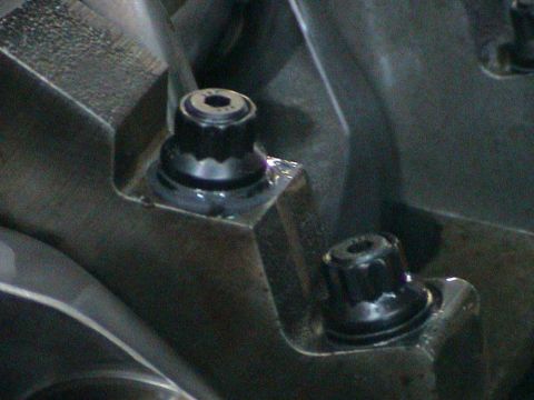 1979 Ford Bronco - Engine block detail showing two bolts, likely part of an engine build.