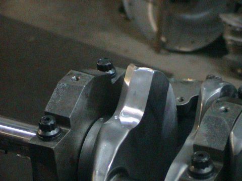 1979 Ford Bronco - Close-up view of an engine crankshaft and its bearing caps, indicating internal engine work.
