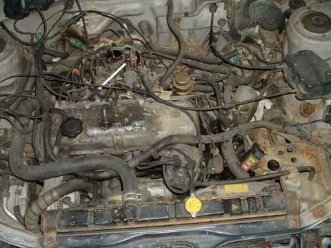 1986 Toyota Corolla - Stock engine (Yes that's a ball-point pen jammed into that vacuum line)