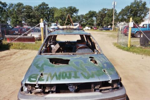 1996 Ford Bronco - This car appears to be prepared for a demolition derby, with significant damage and custom paint.
