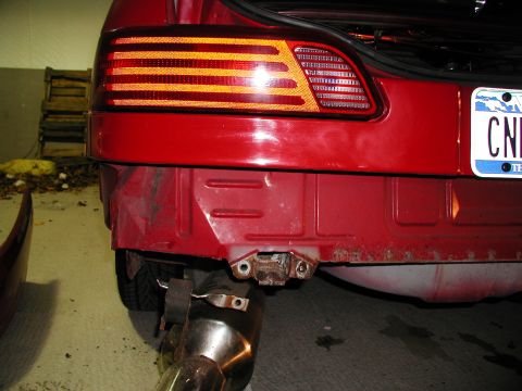 1992 Ford Taurus - Rear view of a 1992 Ford Taurus showing the taillight and bumper area.