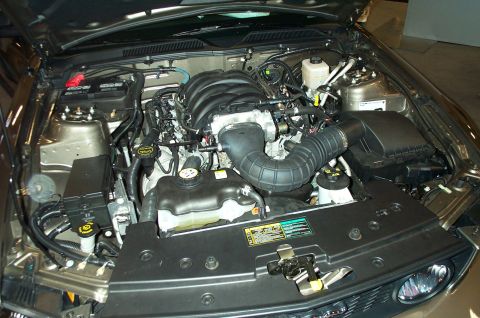 2001 Ford Crown Victoria - Close-up view of a car's engine bay, showing the V8 engine and associated components.