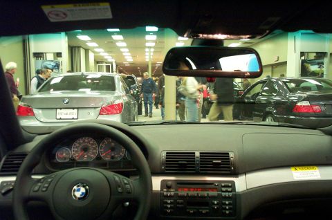 2001 Ford Crown Victoria - Interior view of a silver BMW 5 Series, with a "545i" badge visible on the rear.