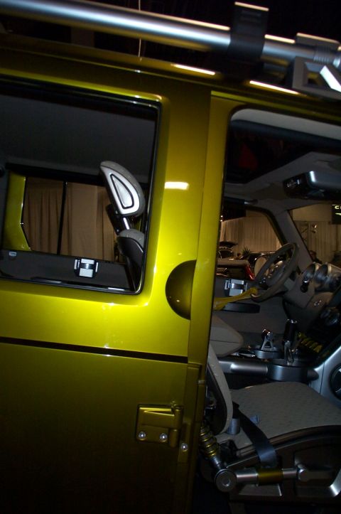 2001 Ford Crown Victoria - Interior view of a yellow SUV with a distinctive design and visible roll cage structure.