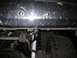 1989 Ford Bronco - Close-up view of tow hooks being installed on the frame of a vehicle.