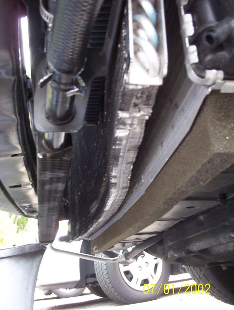 2003 Ford Taurus - Underside view of car radiator and engine bay components, with a watermark dated 01/01/2002.