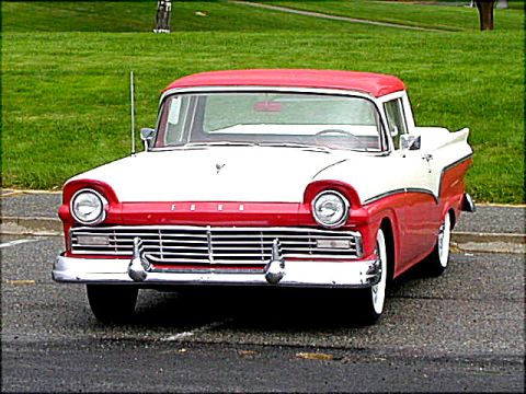 1967 Ford Ranchero - A two-tone red and white 1957 Ford Ranchero pickup truck is viewed from the front.