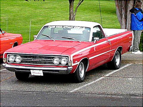 1967 Ford Ranchero - A red and white 1968 Ford Ranchero is parked, with a person in a blue jacket visible to the right.