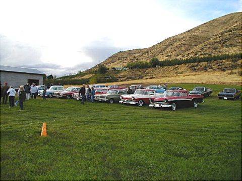 1967 Ford Ranchero - A gathering of vintage automobiles on display at an outdoor event.