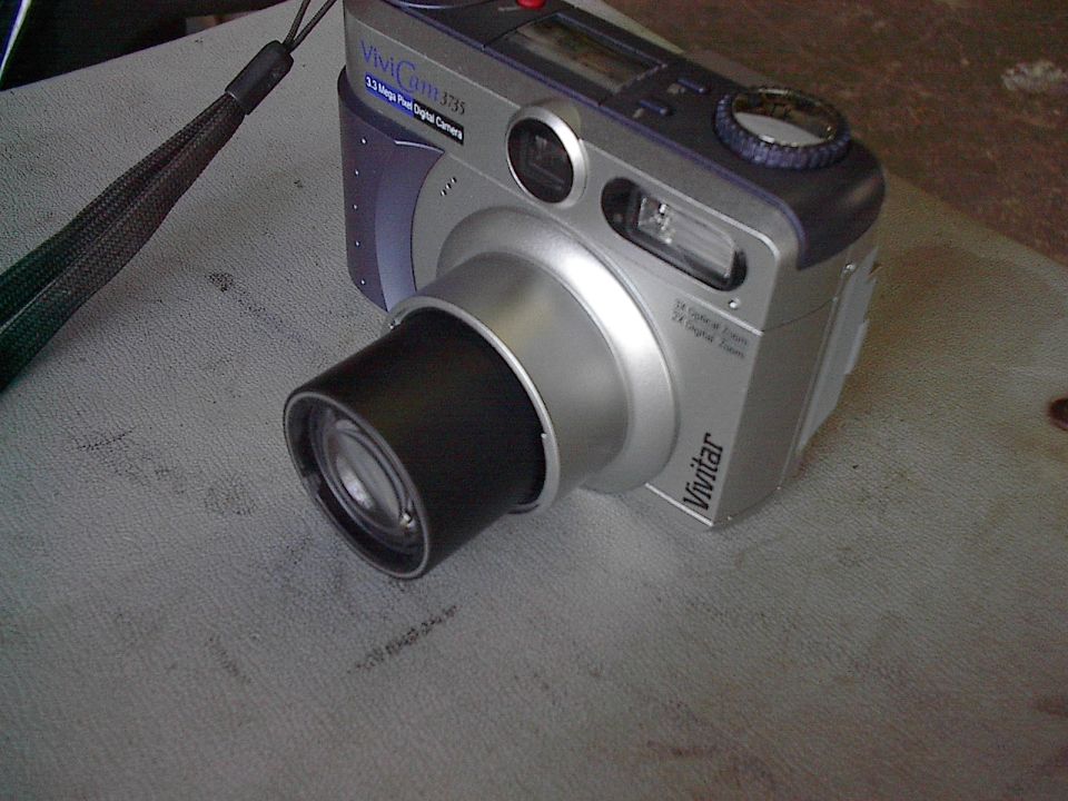 This is the camera I use to take most of my pics (obviously not this shot as it's not too clear).  $145.00 CDN (it was $99 American when available) and has optical zoom, great macro abilities (close ups) and 3.3 megapixels.  Takes sound clips and a good beating, though this is my second under warantee.