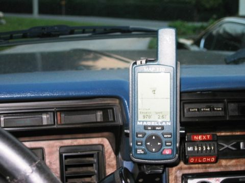 1985 Ford Bronco - A Magellan GPS unit is mounted on the dashboard of a vehicle, showing elevation and speed.