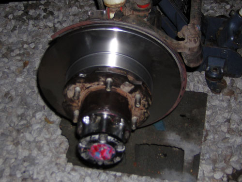 new brake rotor/caliper/brakeline installed

found a chunk of solid something that shot out of the caliper while bleeding..may have been part of the brake issues