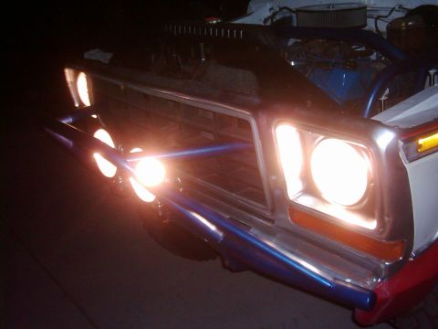 1978 Ford Bronco - Front view of a 1978 Ford Bronco, equipped with auxiliary lights mounted on a blue bar.