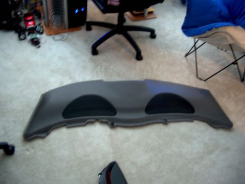 1998 Ford Taurus - This is a rear speaker deck with two integrated speaker grilles, likely a car interior part.