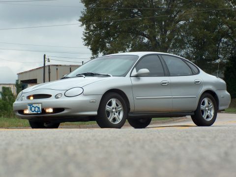 1998 Ford Taurus - This silver 1998 Ford Taurus is shown from a 3q front angle, with the license plate visible.